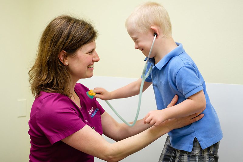 A Child Playing With a Doctor A Child Playing With a Doctor
