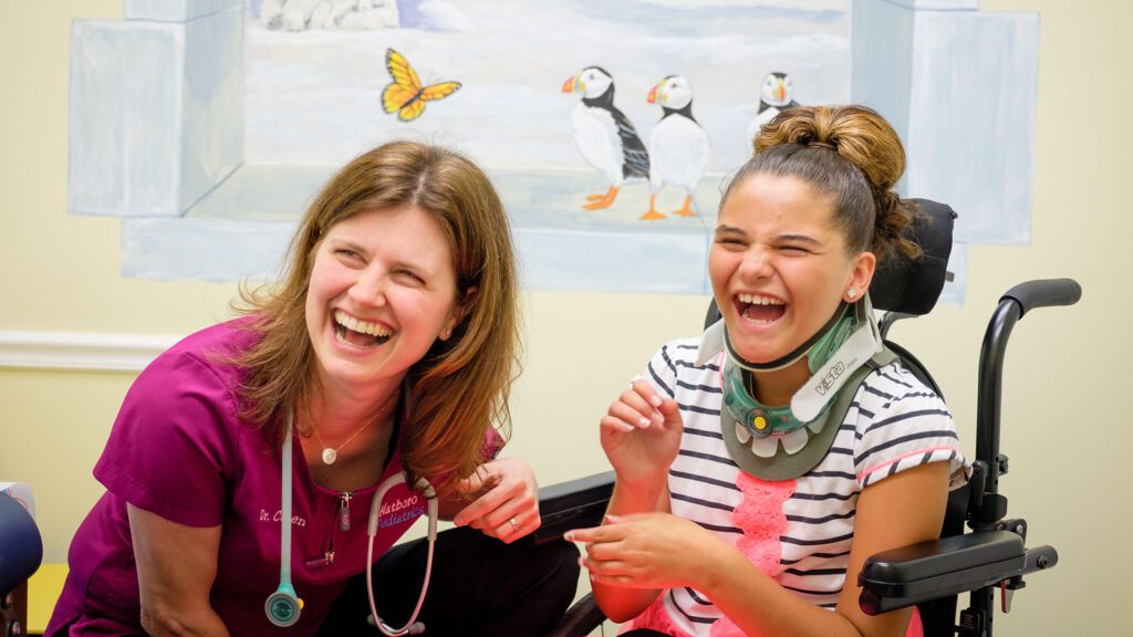 Doctor and girl laughing together. Doctor and girl laughing together.