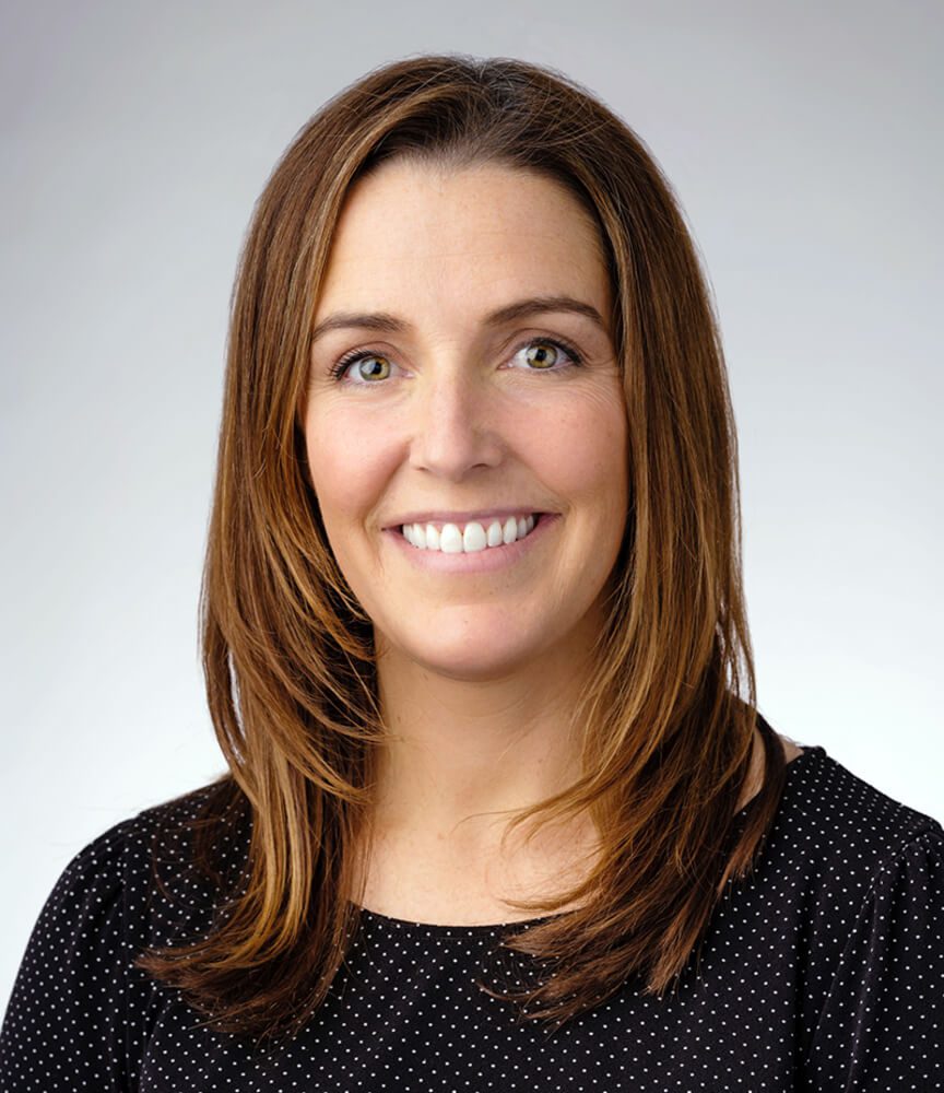 Smiling woman professional headshot with brown hair Smiling woman professional headshot with brown hair